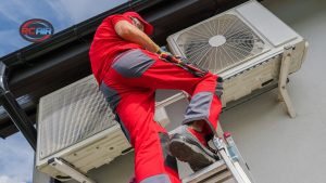 Cleaning debris from air conditioner condenser unit