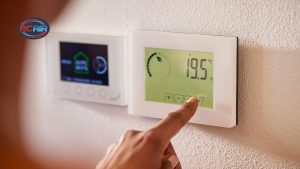 Homeowner setting AC thermostat for summer efficiency