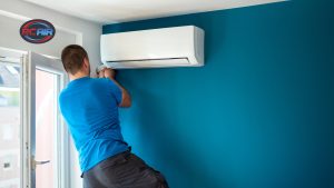 Person adjusting thermostat during AC troubleshooting