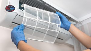 Homeowner changing air conditioner filter